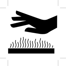 A hand touching a surface marked as hot