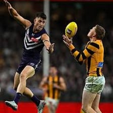 Players contesting the ball during an Australian rules football match