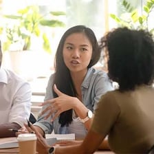 People observing or taking part in a meeting