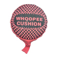 A classic rubber whoopee cushion used as a practical joke.