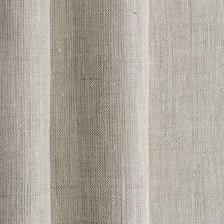 A close-up of natural linen fabric showing its woven texture.