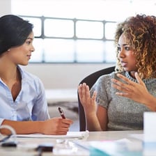 Two people having a one-to-one meeting