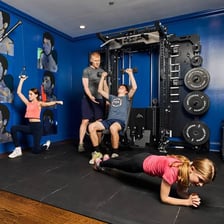 A person exercising with gym equipment.