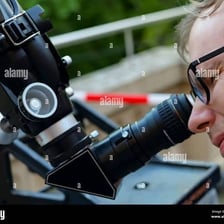 A person studying beneath a starry sky.