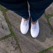 A pair of lightweight canvas plimsoll shoes.