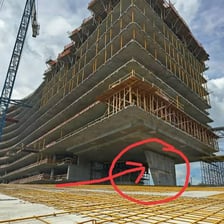 Structural supports holding up a building.