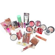 An assortment of cosmetic products such as makeup and skincare items.