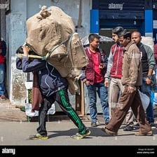 A person carrying a heavy load