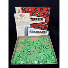 Letter tiles being rearranged to form a new word