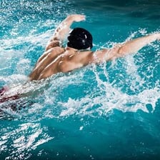 A swimmer performing the butterfly stroke.
