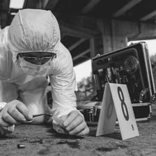 A coroner conducting a death investigation