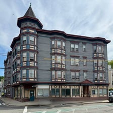 The exterior of a large historic urban tenement building