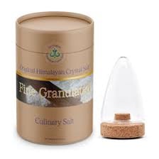 Fine white table salt in a glass salt shaker