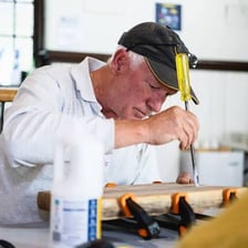 A person repairing an object