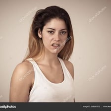 A person displaying an extremely angry facial expression.