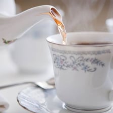 Several cups of tea arranged for serving.