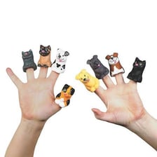 A hand puppet depicting a dog beside a domestic cat