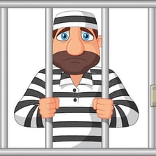 A prisoner seen behind barred cell doors