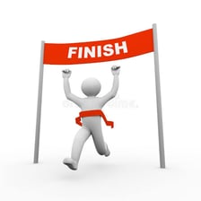 A person reaching a goal at a finish line