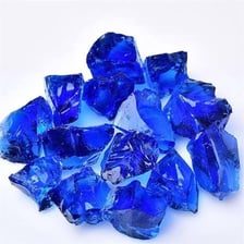 A photograph of a gemstone in its natural, uncut form