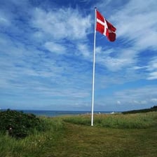 A Danish coastal landscape with the Danish flag