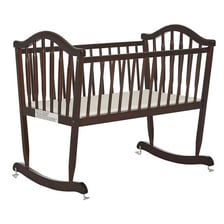 A wooden cradle designed as a bed for a baby.