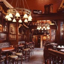 The interior of a British pub with a bar counter