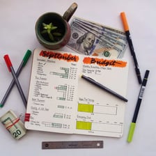 A pen beside a receipt representing an expense