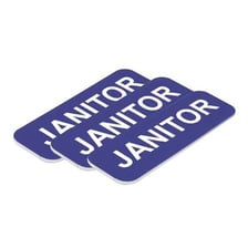 A name tag attached to a worker’s uniform