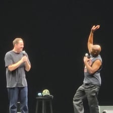 A performer imitating a well-known person on stage.