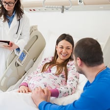 A newborn baby in a hospital delivery setting