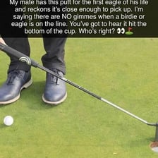 A golfer putting on a golf course