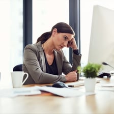 A focused worker persevering at a desk