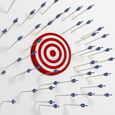 A young woman beside a missed target
