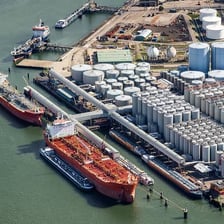 A cargo ship in port, illustrating goods being stopped by an embargo.