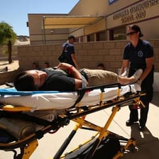 Paramedics carrying a patient on a stretcher
