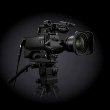 A television studio camera filming a broadcast
