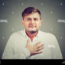 A person expressing regret with an apologetic gesture