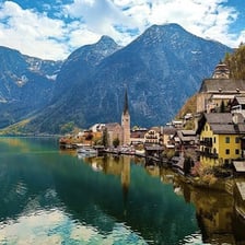 A mountain landscape in Austria, with Alpine peaks and a valley.