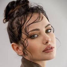 A fashion model posing for a portrait.