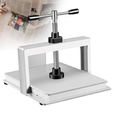Paper being pressed in a printing or bookbinding press