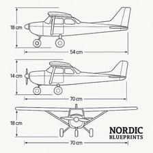An architectural blueprint shown alongside an aircraft