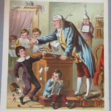 A teacher standing in a classroom.