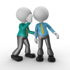 One person whispering quietly to another