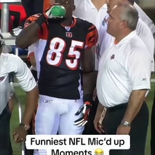 A football coach encouraging players during a match