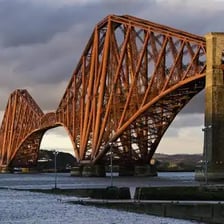 The red Forth Bridge spanning the Firth of Forth in Scotland