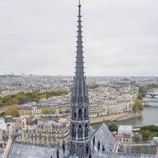 A church tower topped by a tall pointed spire.