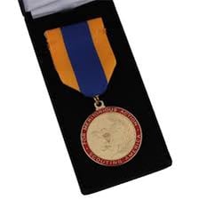 A medal presented to recognize achievement