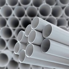 White PVC plastic pipe made from polyvinyl chloride
