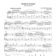Sheet music for a piano étude beside a piano